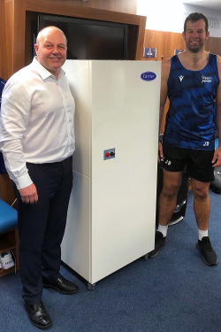 TCUK’s David Dunn with an OptiClean unit in position in Sale Shark’s changing rooms